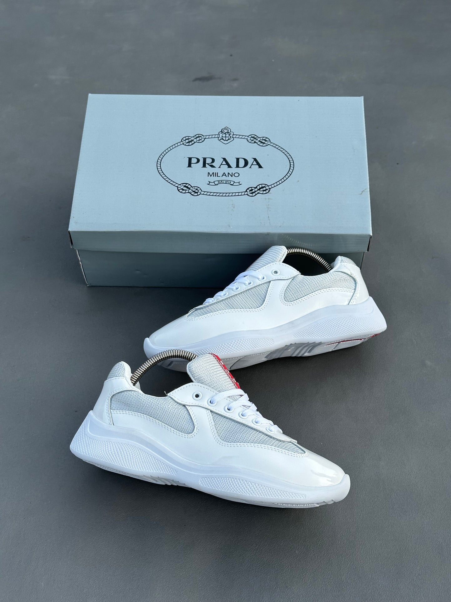 Baskets Prada America's Cup en cuir verni et tissu technique Blanc