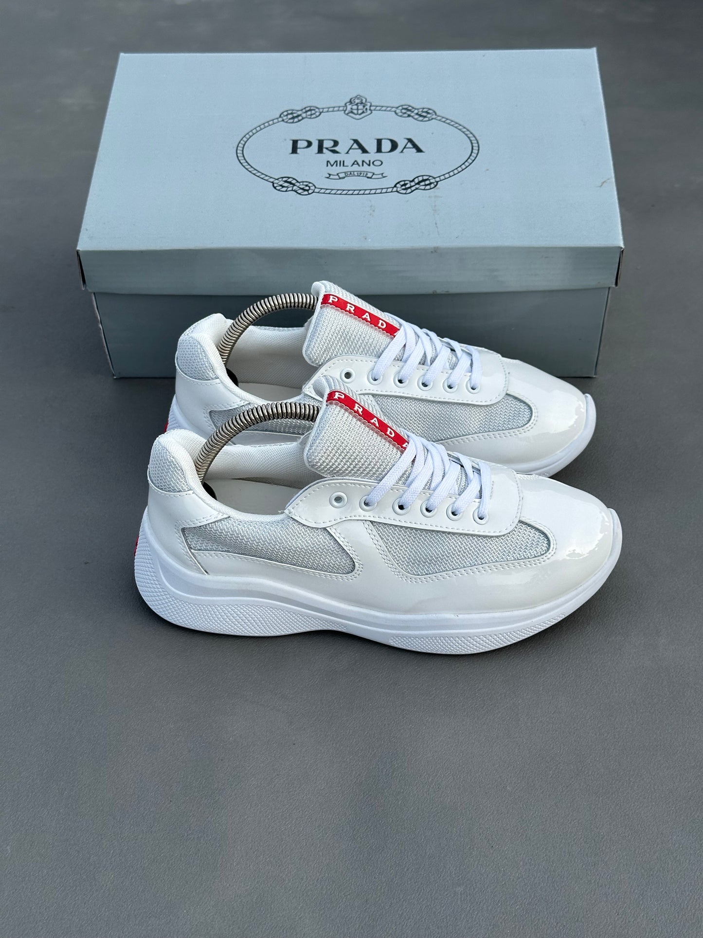 Baskets Prada America's Cup en cuir verni et tissu technique Blanc