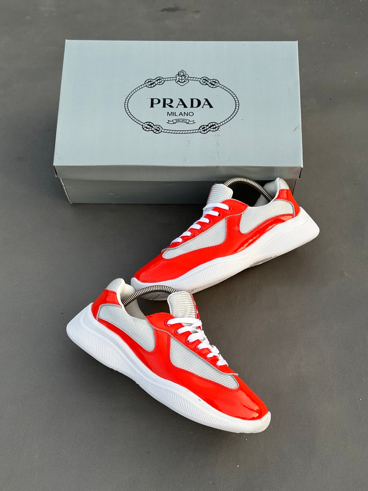 Baskets Prada America's Cup en cuir verni et tissu technique Rouge-Blanc